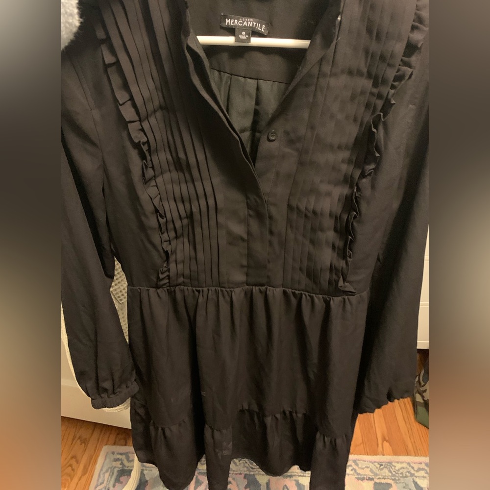 Black dress with textured - tuxedo feature and ruffle